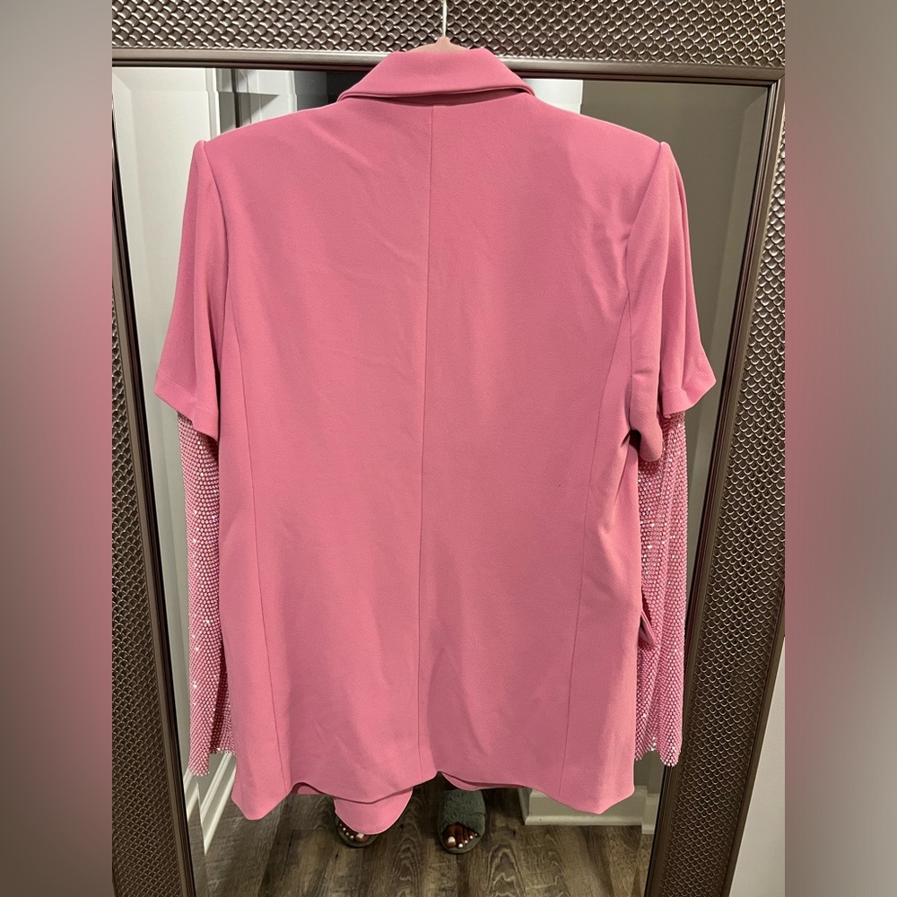 Pink blazer with bedazzled sleeves